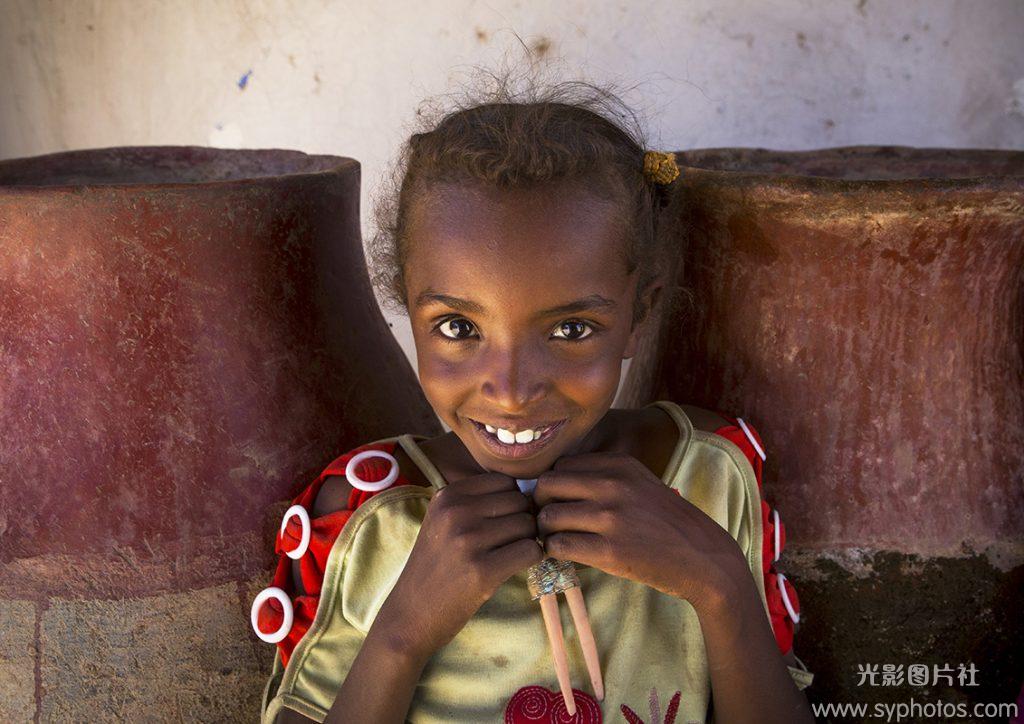 Smiling Sudanese Girl In Front Of Water Jars, Gunfal, Sudan