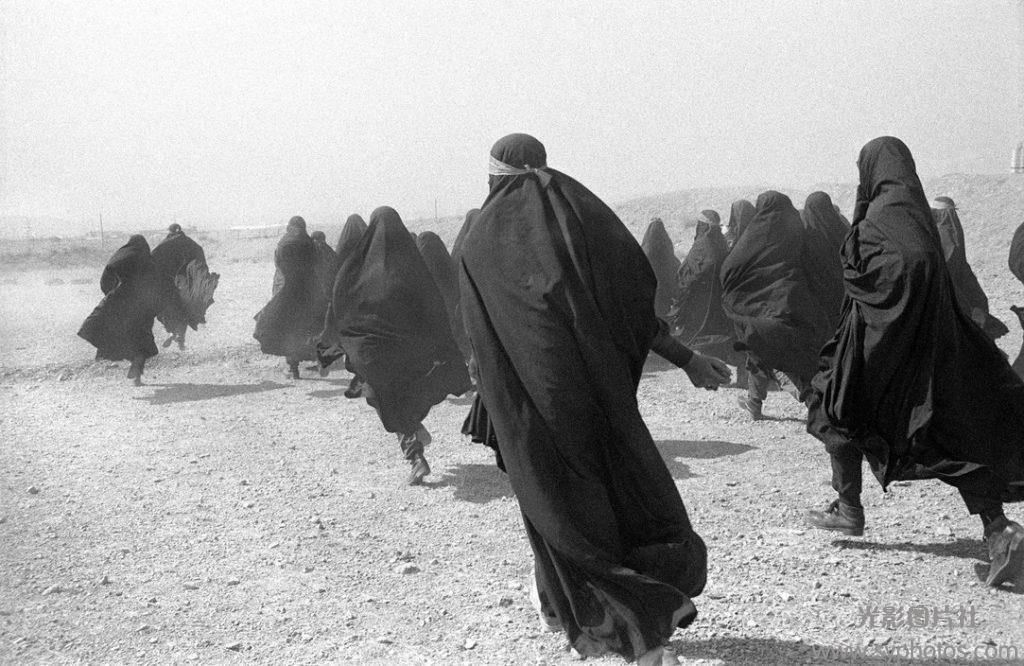 Tehran. 
Veiled women training shooting in the outskirts of the city.